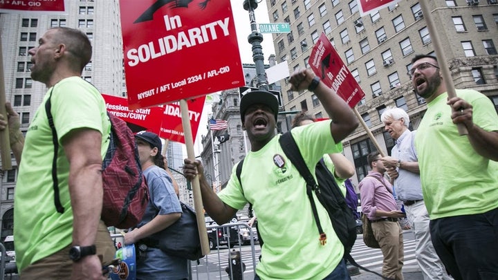 Union activists and supporters rally in Lower Manhattan against the U.S. Supreme Court’s ruling in the Janus case. Over 20 st