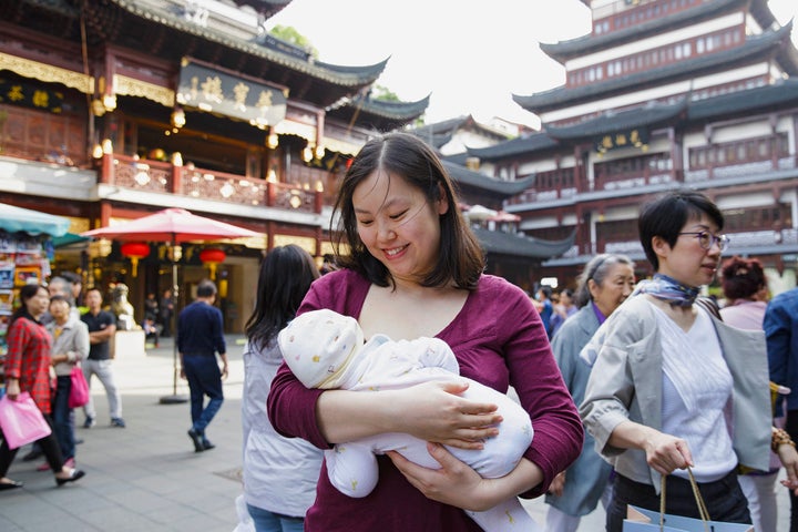 Tanxian, a Chinese mother,&nbsp;nurses her baby in Shanghai.&nbsp;