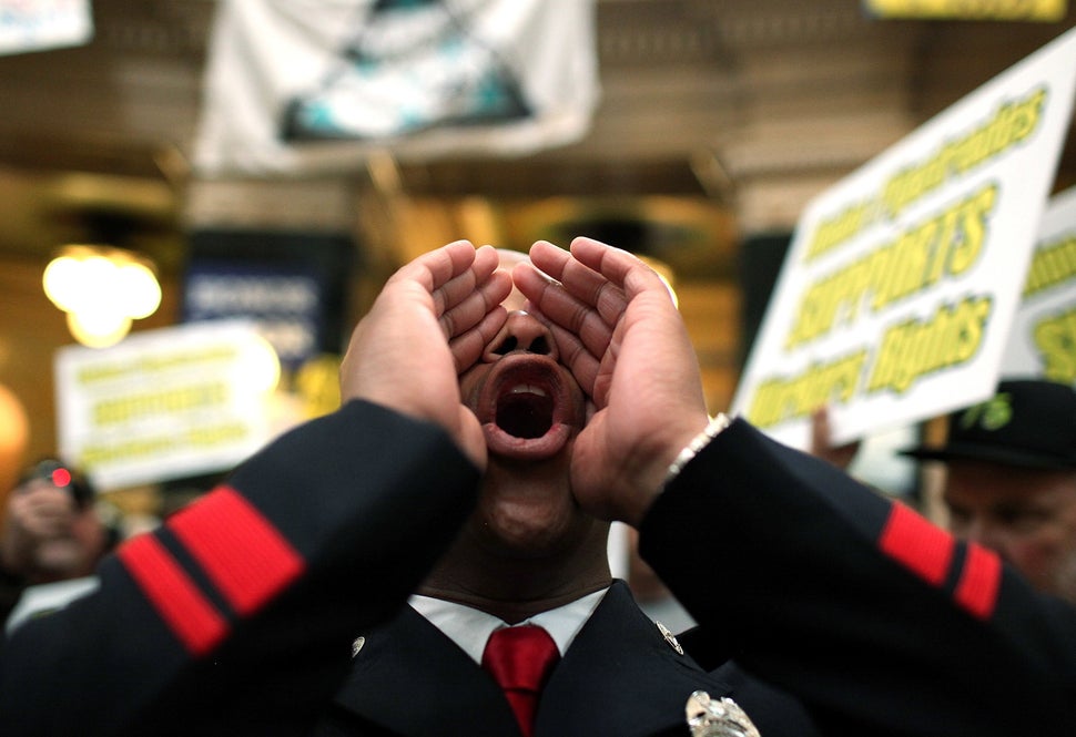 Mitchell leads a chant as union members protest at the State Capitol in 2011.