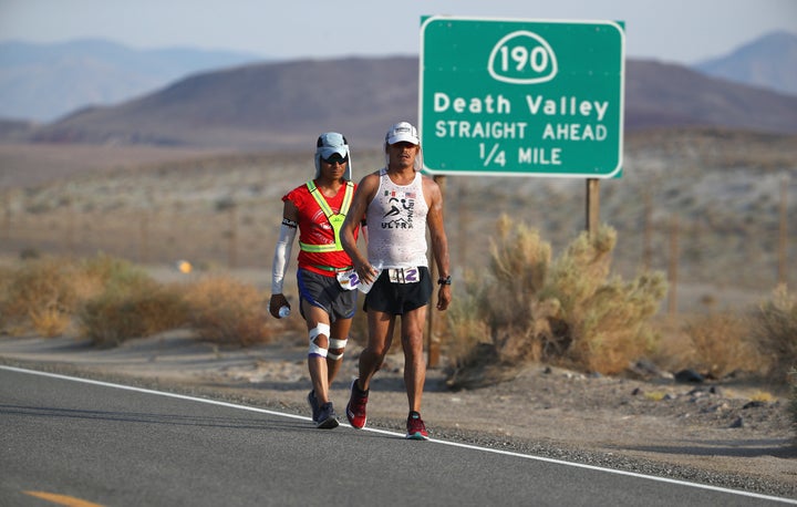 People walk through Death Valley in July 2017, the month previously recorded as the planet's hottest.