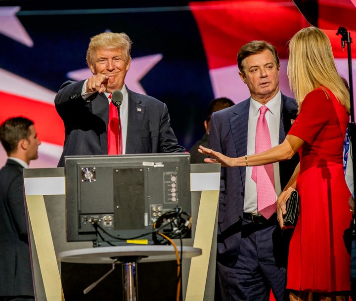 Paul Manafort stands between President Donald Trump and Ivanka Trump during a sound check at the Republican National Convention in July 2016.
