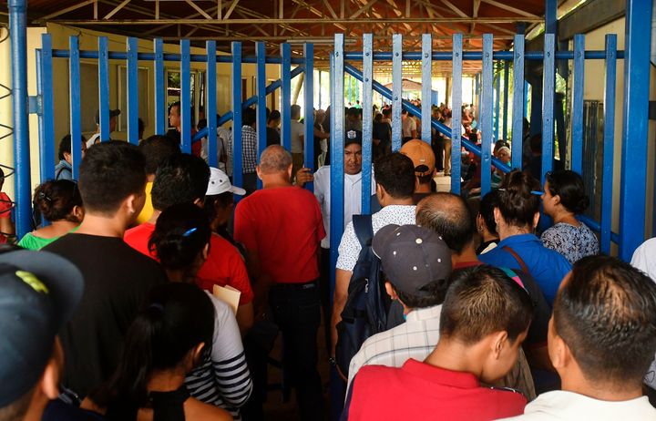 Nicaraguans line up at a migration office in Managua on June 13 to obtain passports to be able to go to other Central American countries amid unrest.