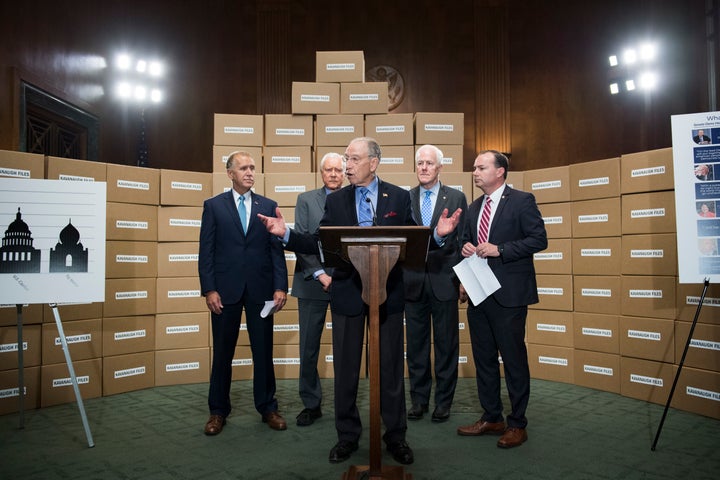 Republican Senate Judiciary Committee members standing with boxes representing roughly 1 million pages of documents on Supreme Court nominee Brett Kavanaugh.