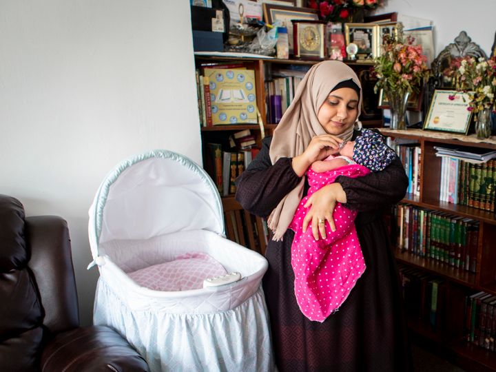 Sondos al-Silwi and her 2-week-old daughter, Mayar. Because of the travel ban on immigration from several Muslim-majority countries, al-Silwi’s husband must remain in Yemen, and she has decided to move there to be with him.