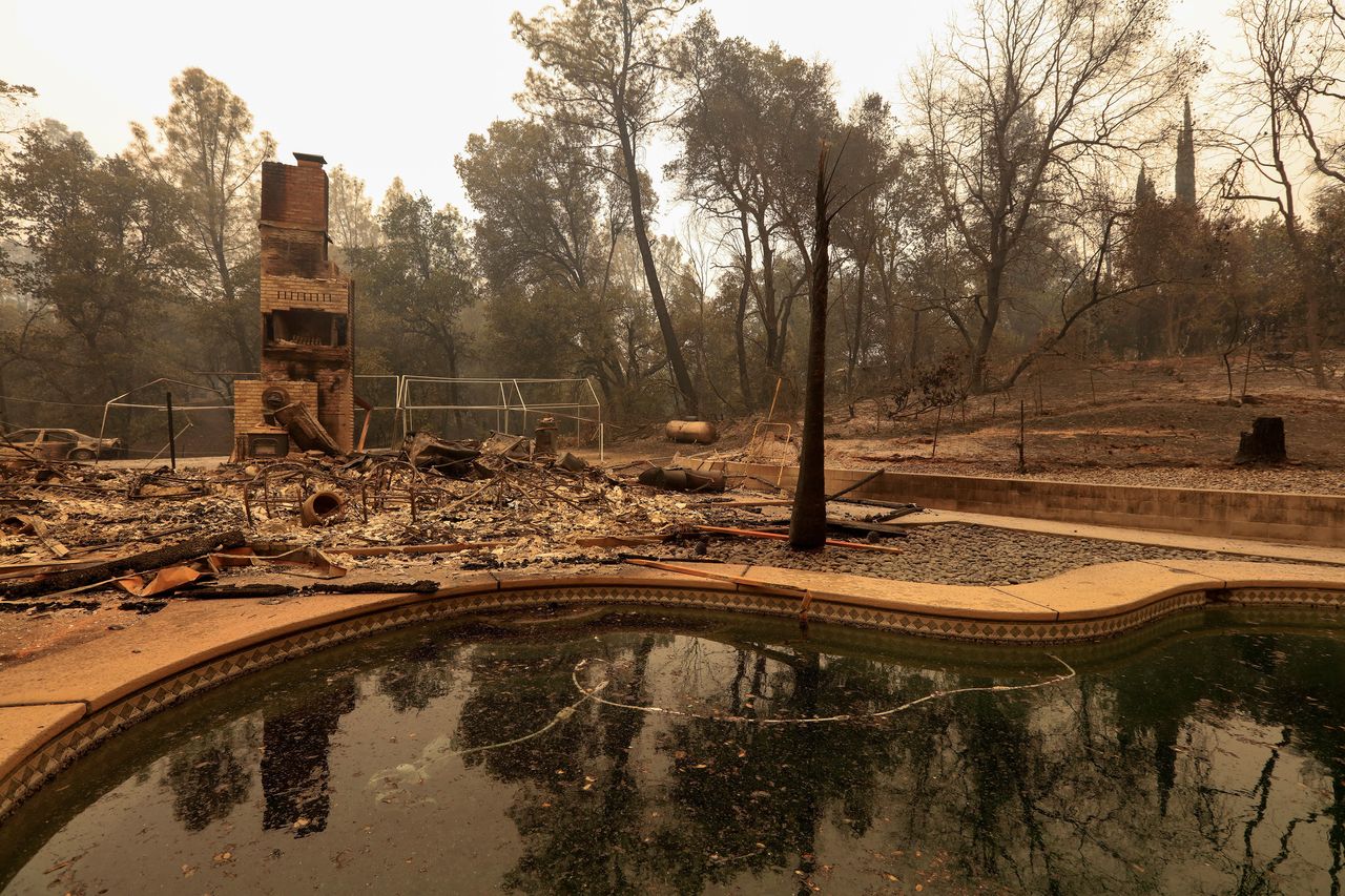 The debris of a burned home is seen July 28 after the Carr Fire west of Redding, California.