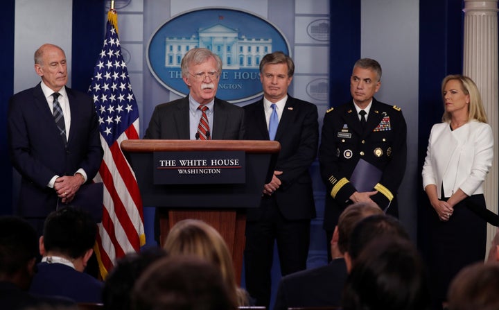 Director of National Intelligence Dan Coats, left, White House national security adviser John Bolton, FBI Director Christopher Wray, National Security Agency Director Paul Nakasone and Homeland Security Secretary Kirstjen Nielsen hold a briefing on election security on Thursday. “Our democracy itself is in the crosshairs,” Nielsen said.