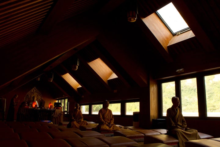 Monks sit in meditation in Longquan Monastery in Beijing, Capital of China, Sept. 27, 2015.