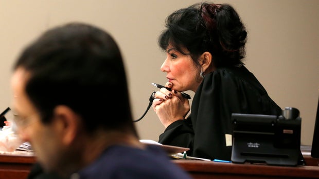 Judge Rosemarie Aquilina watches as Former Michigan State University and USA Gymnastics doctor Larry Nassar listens to impact statements during the sentencing phase in Ingham County Circuit Court on January 24, 2018 in Lansing, Michigan.
More than 100 women and girls accuse Nassar of a pattern of serial abuse dating back two decades, including the Olympic gold-medal winners Simone Biles, Aly Raisman, Gabby Douglas and McKayla Maroney -- who have lashed out at top sporting officials for failing to stop him.    / AFP PHOTO / JEFF KOWALSKY        (Photo credit should read JEFF KOWALSKY/AFP/Getty Images)