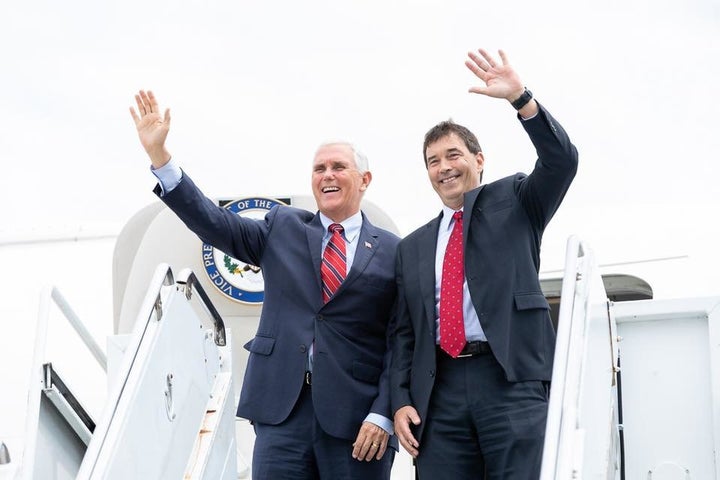 Vice President Mike Pence, left, and Republican candidate Troy Balderson wave to the crowd after a Pence rally for Balderson on Monday.