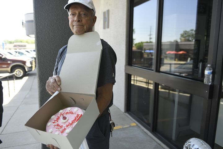George Hefner, of Roxborough Village, became emotional after buying a cake with the inscription "God Bless America and Masterpiece Cakeshop," from baker Jack Phillips, owner of Masterpiece Cakeshop. "He fought hard for us and our religious freedom," Hefner said.