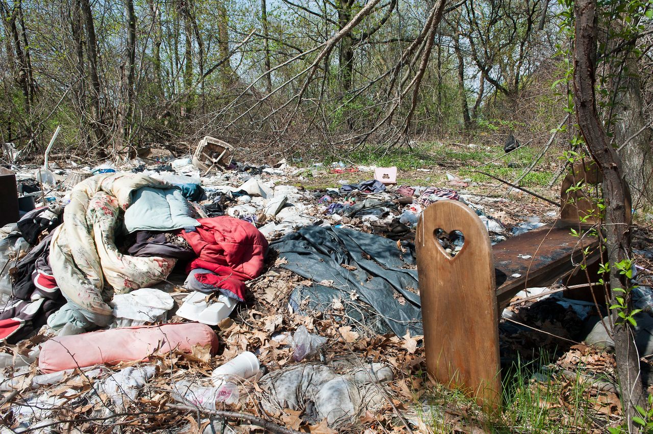 Abandoned clothing and sleeping bags near the Merrimack River are signs of Lawrence and Lowell's homeless population. In Lowell, the homeless population nearly doubled between 2005 and 2017.