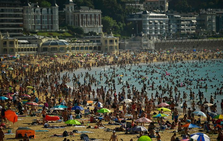 The hot weather is also affecting Spain, where people crowded beaches at La Concha in San Sebastian.