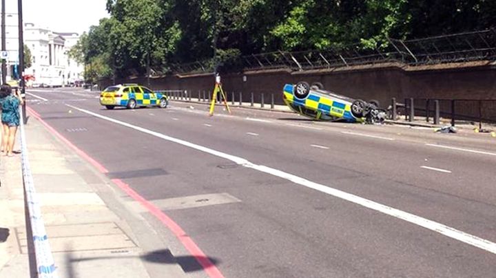 A police car overturned near Buckingham Palace on Saturday morning.