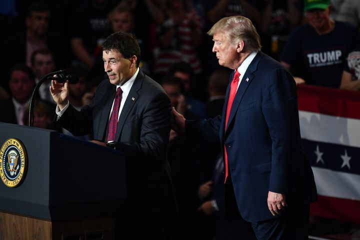 Republican House candidate Troy Balderson speaks next to President Donald Trump at a rally in Lewis Center, Ohio, on Saturday.