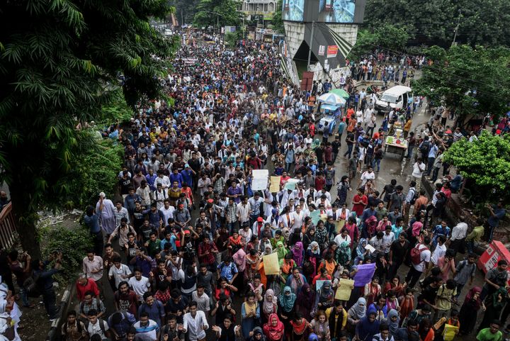 Bangladeshi students are seen during clashes with the police amid a student protest in Dhaka on Sunday.