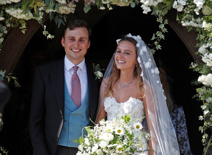 Daisy Jenks and Charlie Van Straubenzee emerge from the church after their wedding.