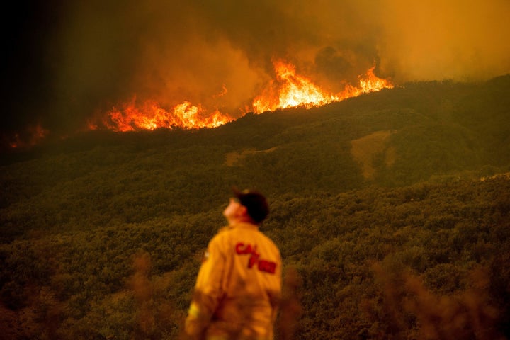 Battalion Chief Matt Sully directs operations on the Ranch fire, part of the Mendocino Complex fire, burning near Clearlake Oaks on Sunday.