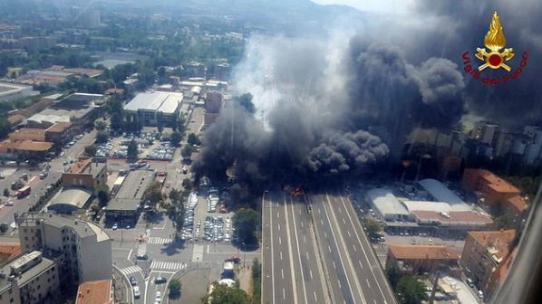 Italian media said a truck carrying cars collided on a bridge with another tanker truck containing inflammable materials.