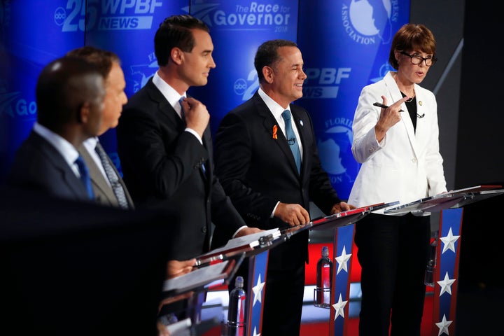 Democratic gubernatorial candidates, from right, Gwen Graham, Philip Levine, Chris King, Jeff Greene and Andrew Gillum await the start of a debate ahead of the Democratic primary for governor on Thursday, Aug. 2, 2018, in Palm Beach Gardens.