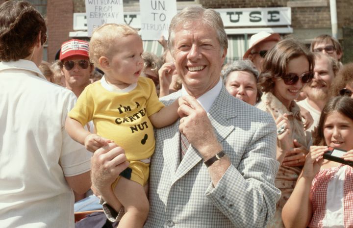 President Jimmy Carter poses with a baby in Quincy, Illinois, in 1979. Last year, 9,753 boys and 598 girls were named Carter. 