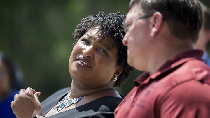 Georgia Democratic gubernatorial candidate Stacey Abrams, left, is more than $200,000 in debt, but says her indebtedness should not keep her from becoming governor. If elected, Abrams plans to start a financial literacy program for elementary school students.