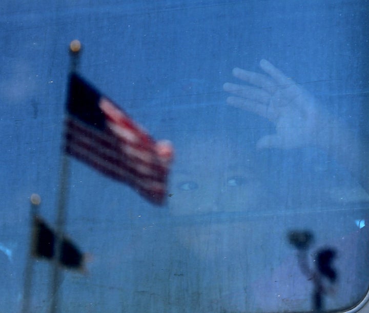 A migrant child looks out the window of a bus at a U.S. Customs and Border Protection detention center in Texas on June 23.