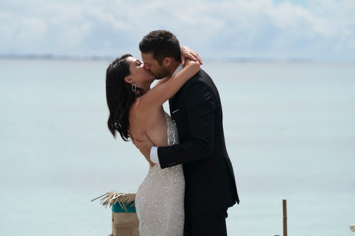 Becca and Garrett kiss during the final rose ceremony in the Maldives.