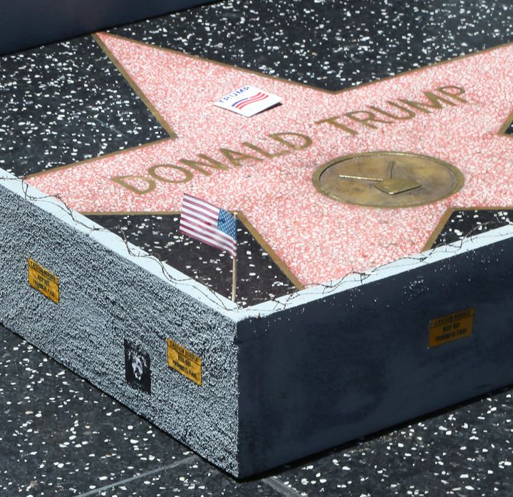Plastic Jesus constructed a wall around Donald Trump's star on the Hollywood Walk of Fame in July 2016.