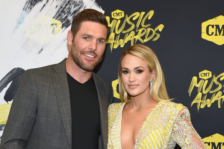 Mike Fisher and Carrie Underwood attend the 2018 CMT Music Awards together on June 6. 