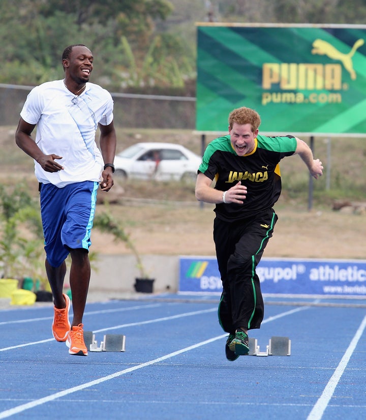 Harry races Usain Bolt at the University of the West Indies on March 6, 2012, in Kingston, Jamaica.