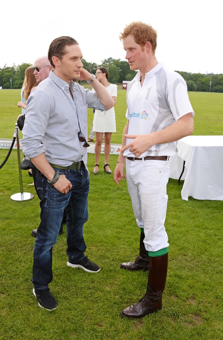 Tom Hardy and Prince Harry chat at the Audi Polo Challenge on June 1, 2014, in Ascot, England.