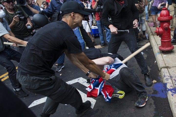 A white supremacist beats a counter-protester at the Charlottesville "Unite the Right" rally in August 2017. ProPublica identified the man in the photo as U.S. Marine Corps Lance Cpl. Vasillios Pistolis.