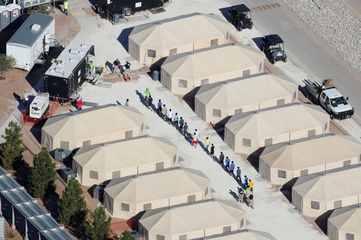 Immigrant children at a tent encampment in Tornillo, Texas, are seen walking single file on June 19.