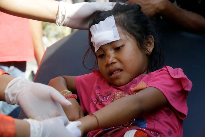 This unnamed girl was treated in Mataram Lombok, Indonesia on Thursday after she was injured in the quake.