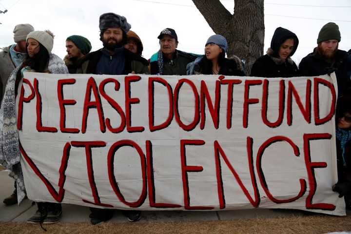 Opponents of the Dakota Access oil pipeline outside the Bank of North Dakota in Bismarck, North Dakota, January 31, 2017