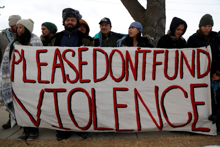 Opponents of the Dakota Access oil pipeline outside the Bank of North Dakota in Bismarck, North Dakota, January 31, 2017