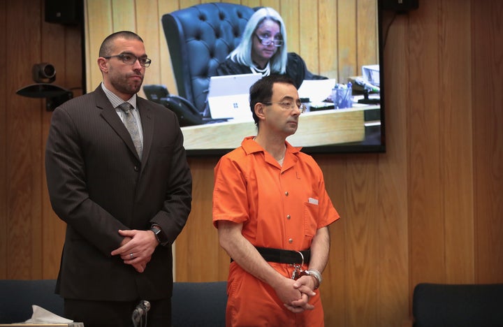 Nassar and former attorney Matt Newburg stand during his sentence hearing with Judge Janice Cunningham in Eaton County Circuit Court on Feb. 5, 2018, in Charlotte, Michigan. 