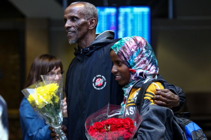 Somane Liban greets his granddaughter Dahaba Matan, a refugee from Somalia, who arrived at the airport in Boise, Idaho, on March 10, 2017.