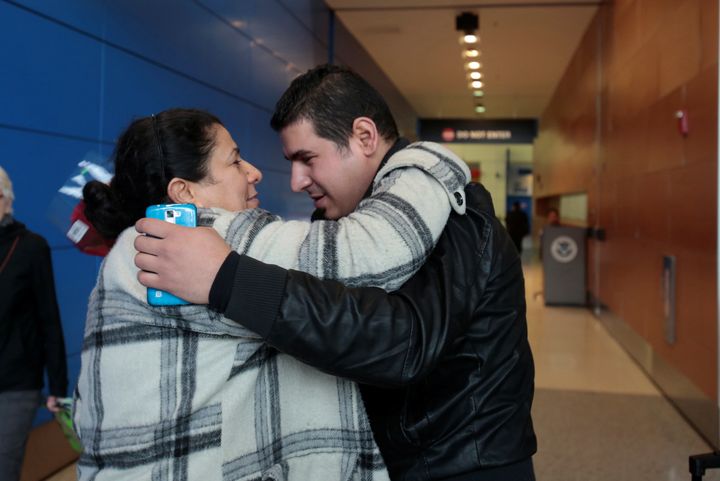 Iraqi refugee Amira Al-Qassab is reunited with her son Rami after arriving with her other children at Detroit Metro Airport in Romulus, Michigan, on Feb. 10, 2017.