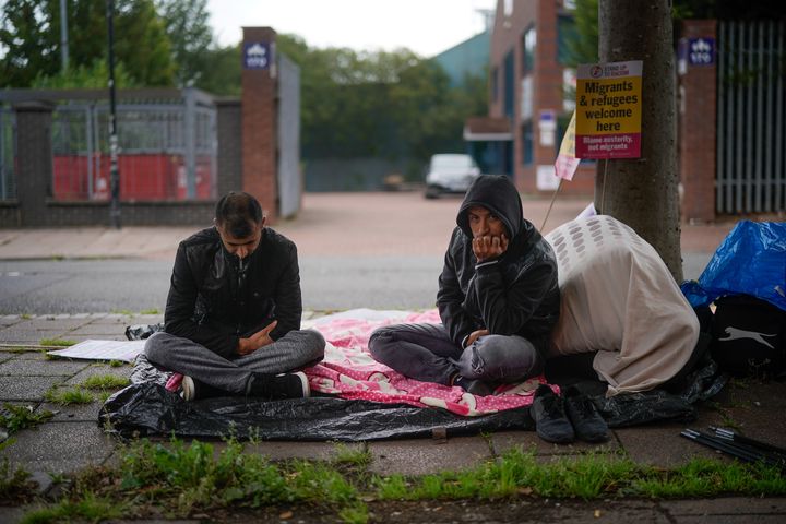 Two Serco tenants protest outside the Home Office in Glasgow. 