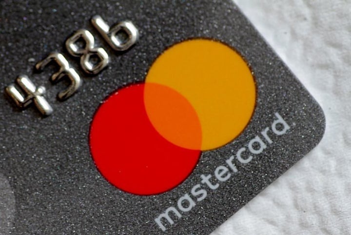 A Mastercard logo is seen on a credit card in this picture illustration August 30, 2017.