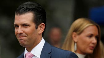 Donald Trump Jr. enters the annual White House Easter Egg Roll with Vanessa Trump lagging behind him on the South Lawn of the White House in Washington, April 2, 2018. REUTERS/Leah Millis
