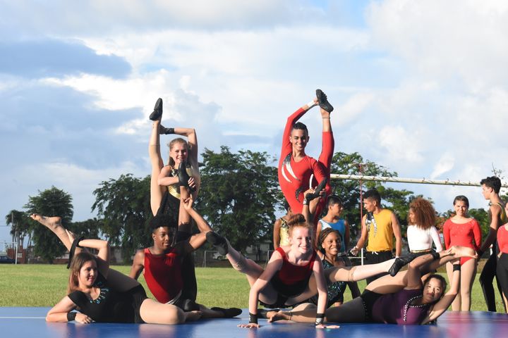 Students from the National Circus School of Puerto Rico and Circus Harmony do a contortion act in the town of Yabucoa. 