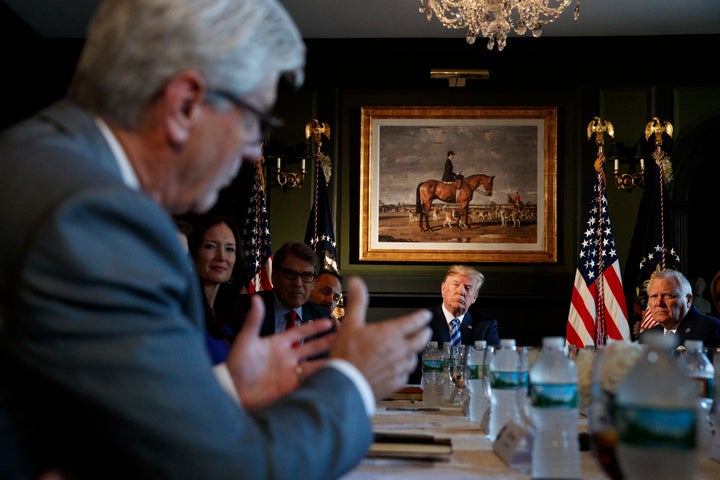 President Donald Trump looks to Mississippi Gov. Phil Bryant, left, as he speaks during a meeting with state leaders about prison reform, Thursday, Aug. 9, 2018, at Trump National Golf Club in Bedminster, N.J. Also seated at the table from left, are Brooke Rollins, Assistant to the President for Strategic Initiatives, Secretary of Energy Rick Perry, Kentucky Gov. Matt Bevin, and Georgia Governor Nathan Deal, right.