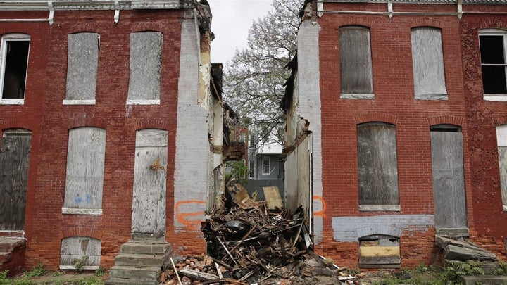 Debris remains where a demolished rowhouse once stood on one of many blocks slated for demolition in Baltimore. When possible