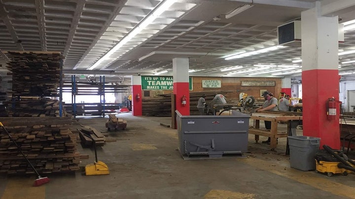 Brick and Board employees at work in their Baltimore warehouse. Brick and Board is a division of Humanim, a nonprofit based in Baltimore that fixes up and sells salvaged construction materials. 