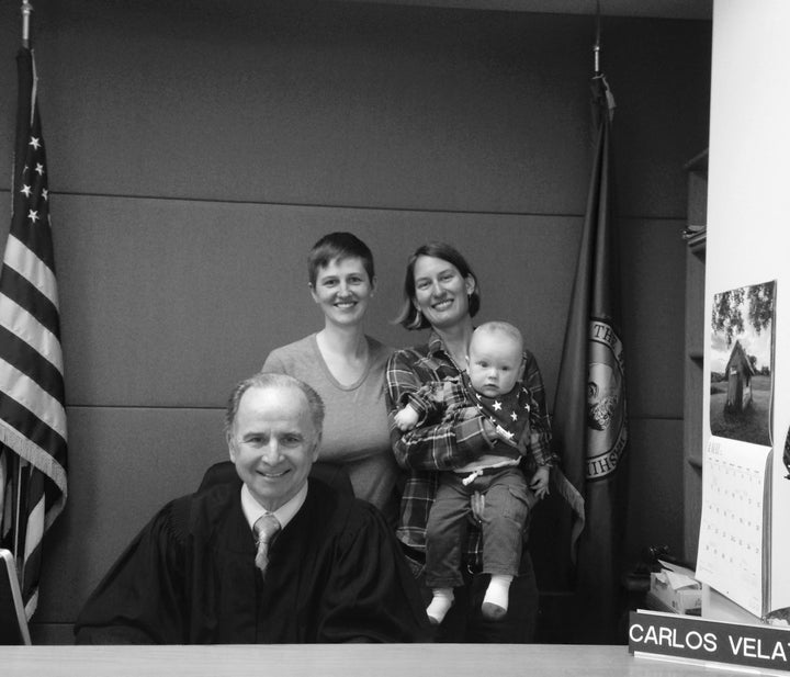 After the adoption hearing. Liegel, Michelle, Finn and the judge who oversaw Liegel's case. King County District Court Building, Seattle.