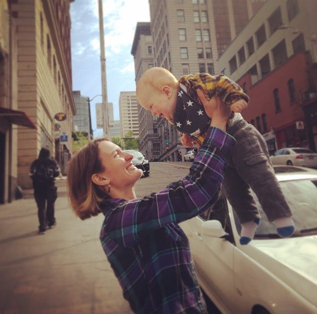 Liegel, holding Finn, just down the street from the King County District Court Building in Seattle, after the adoption was completed.
