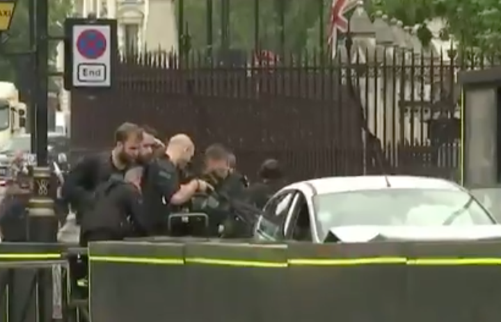 Armed police were seen pointing their weapons directly into the vehicle.