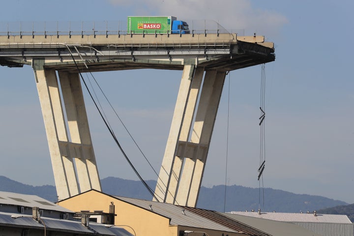 A lorry sits on the Morandi motorway bridge after it collapsed. 